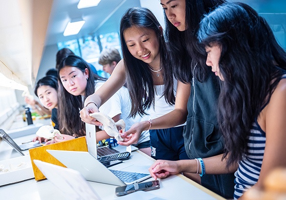 Future Global Leaders monitor with high school students at UBC.